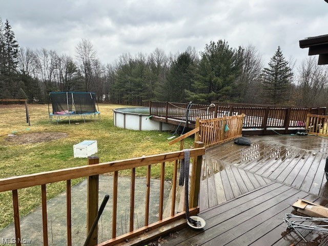 4396 Rootstown Road Rootstown, OH 44272 - Photo 20 of 21 Deck with a yard and a trampoline