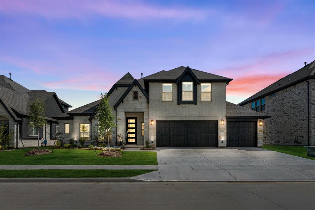 2018 Dundalk Lane Forney, TX 75126 - Photo 2 of 40 a front view of a house with a yard