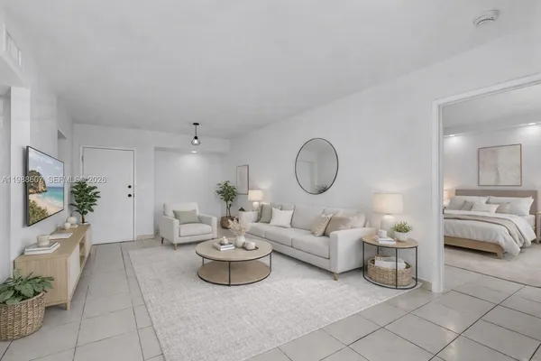 a living room with furniture flowerpot and a potted plant