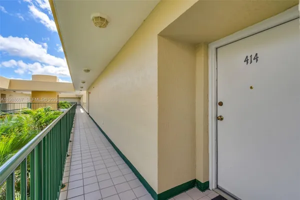 a view of balcony with wooden floor