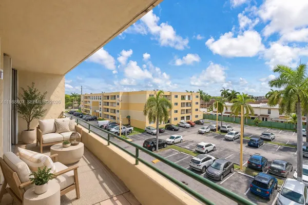 a view of city from balcony with seating space