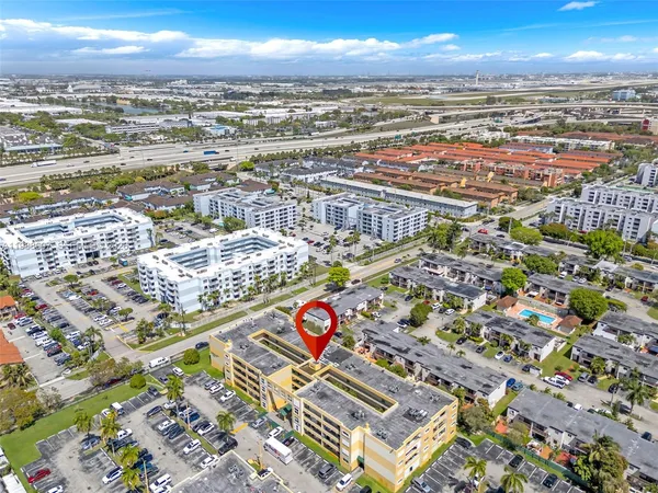 an aerial view of residential building and ocean view