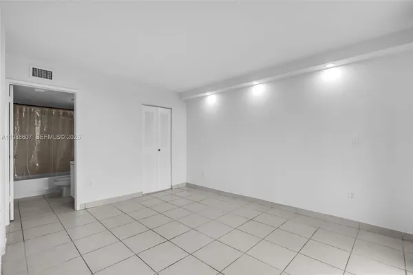 a view of an empty room and window