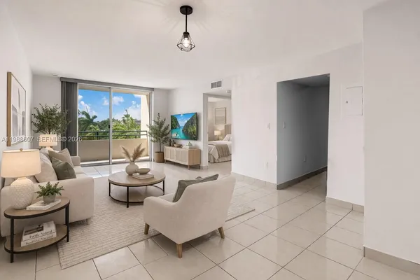 a living room with furniture and a floor to ceiling window