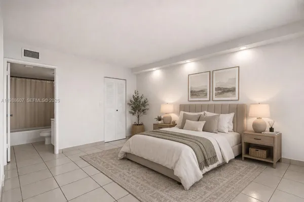 a bedroom with a bed and a night stand