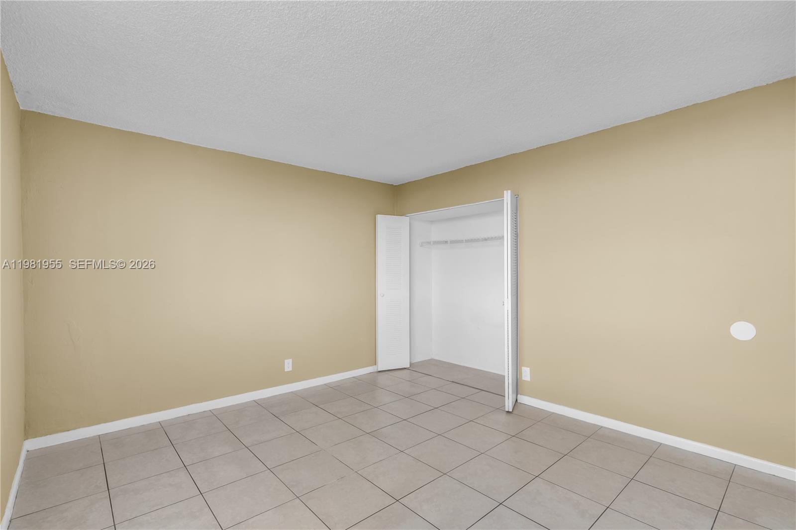 9143 Southwest 77th Avenue, Unit B802 Miami, FL 33156 - Photo 13 of 33 a view of an empty room