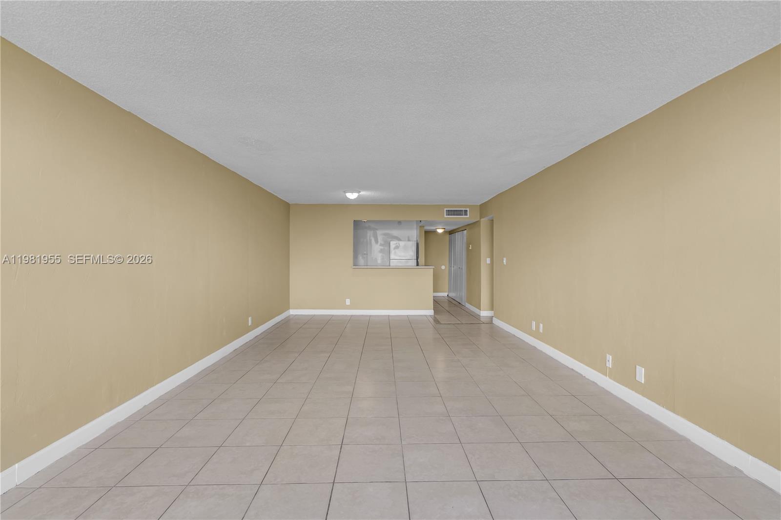 9143 Southwest 77th Avenue, Unit B802 Miami, FL 33156 - Photo 14 of 33 a view of an empty room with a window