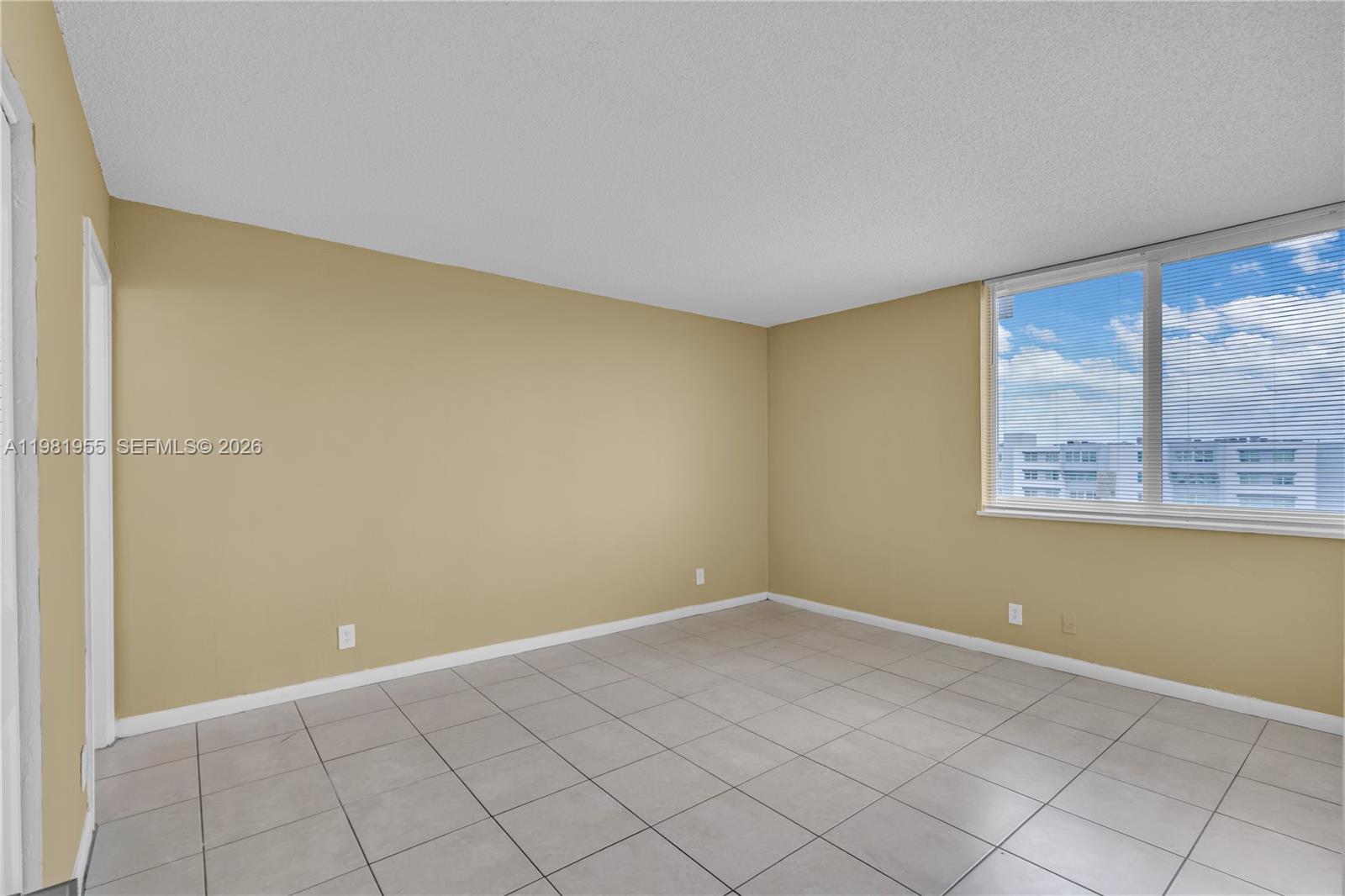 9143 Southwest 77th Avenue, Unit B802 Miami, FL 33156 - Photo 15 of 33 a view of an empty room with a window