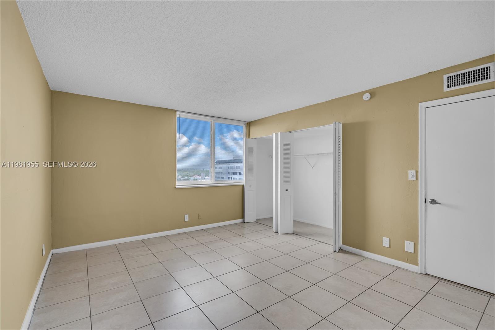 9143 Southwest 77th Avenue, Unit B802 Miami, FL 33156 - Photo 17 of 33 a view of an empty room
