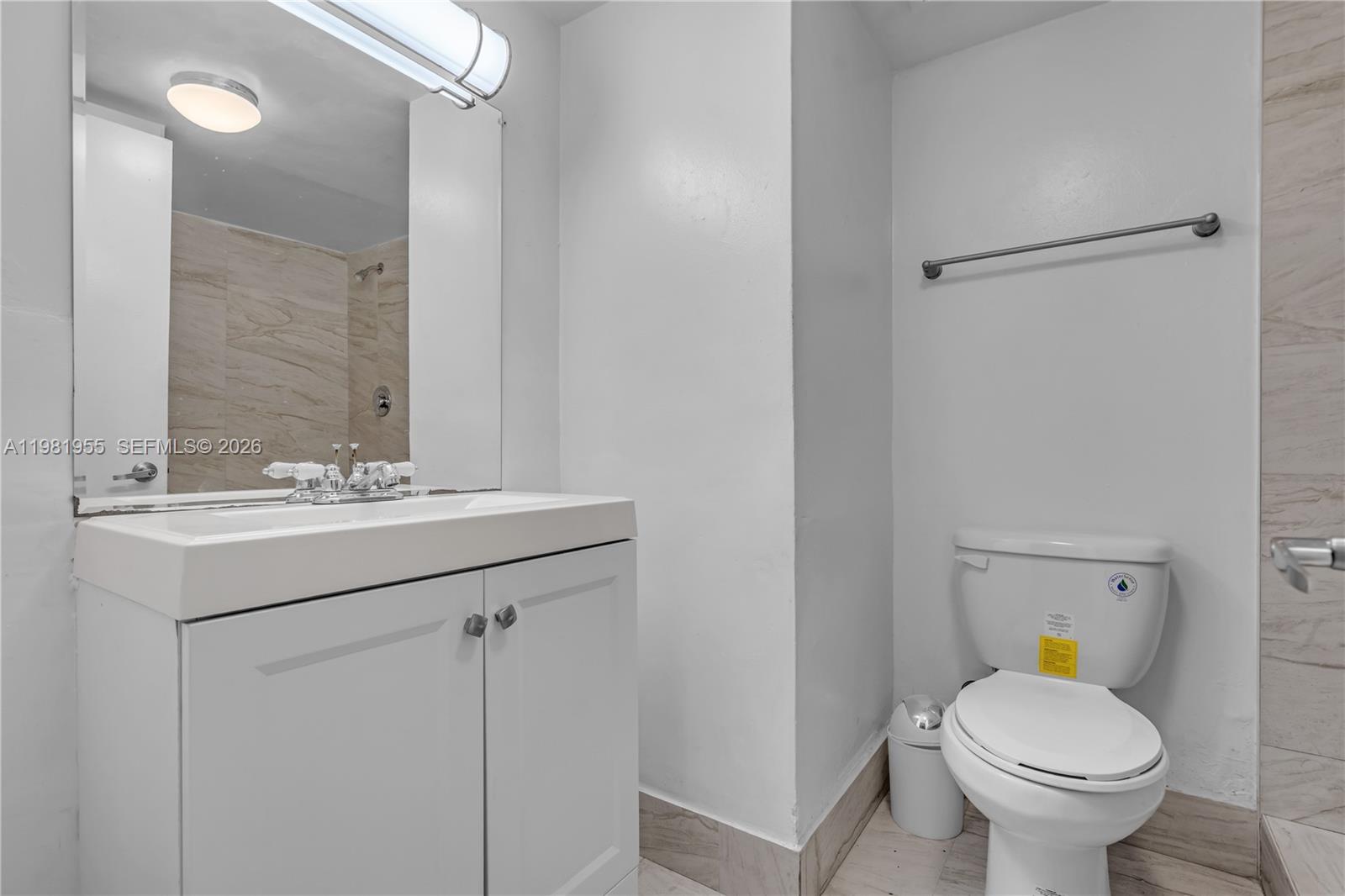 9143 Southwest 77th Avenue, Unit B802 Miami, FL 33156 - Photo 19 of 33 a bathroom with a sink toilet and shower