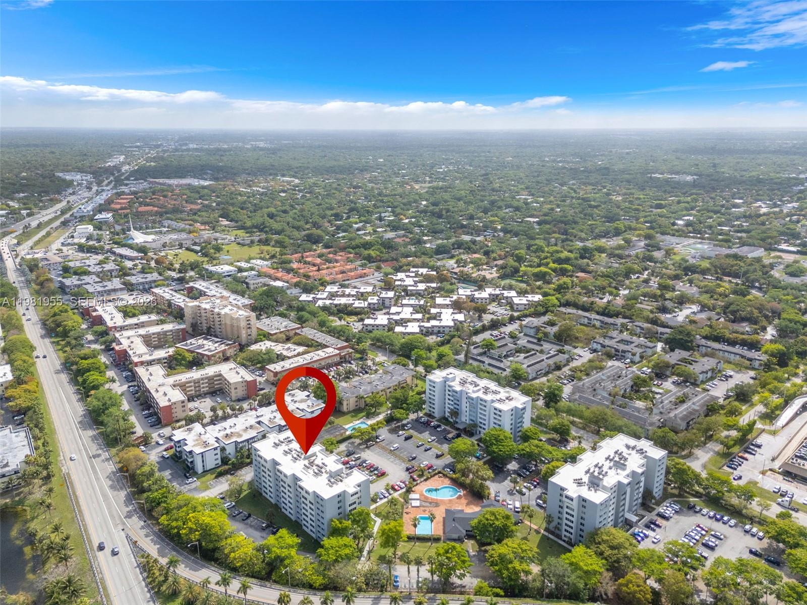 9143 Southwest 77th Avenue, Unit B802 Miami, FL 33156 - Photo 32 of 33 an aerial view of residential houses with outdoor space