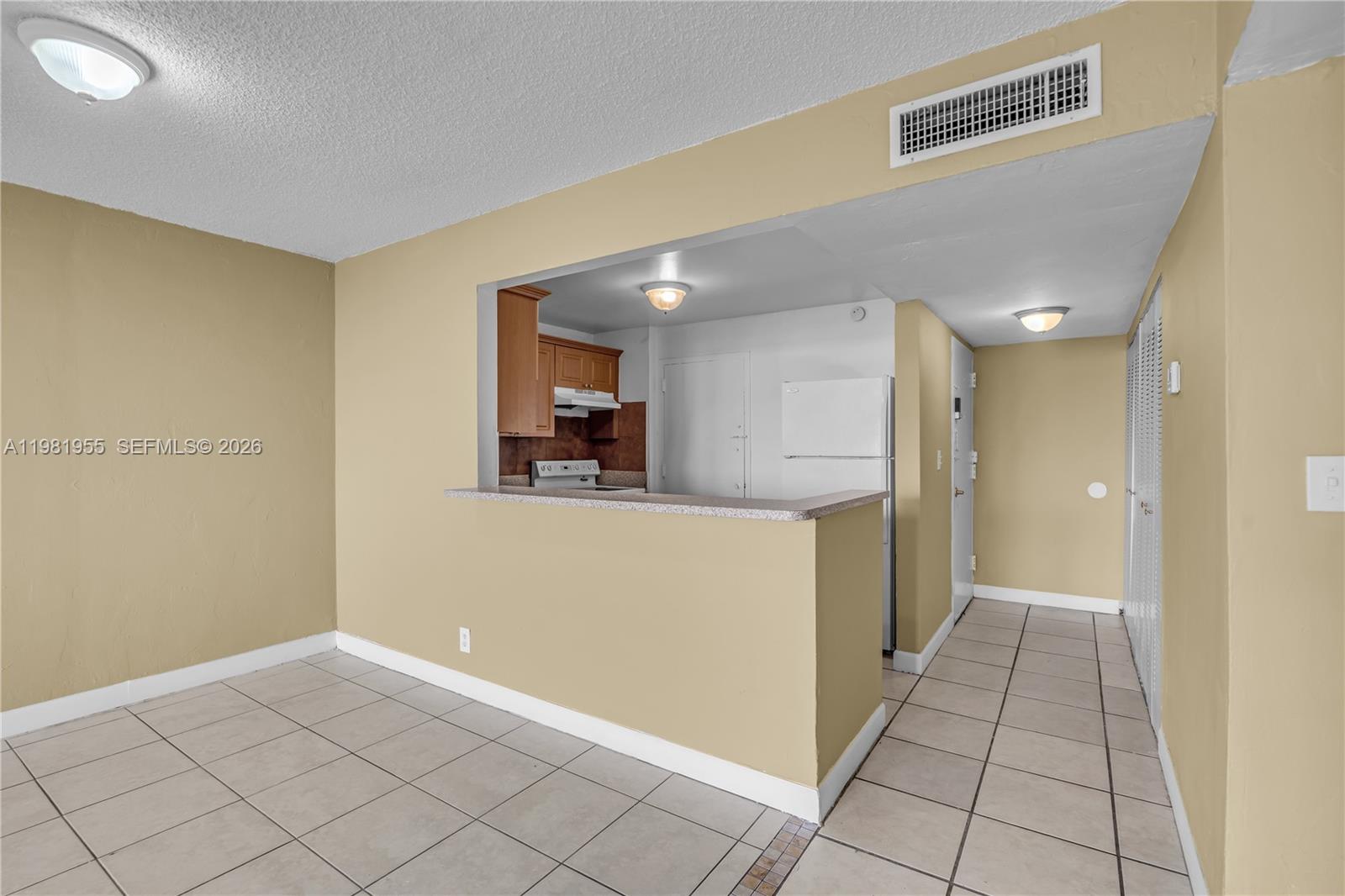 9143 Southwest 77th Avenue, Unit B802 Miami, FL 33156 - Photo 7 of 33 a view of a hallway