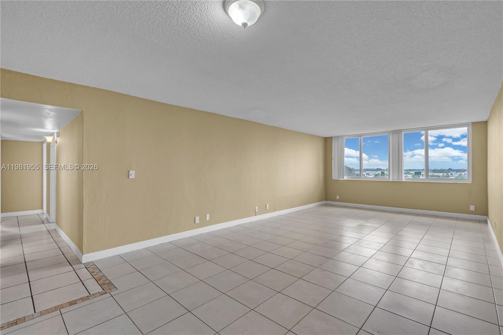 9143 Southwest 77th Avenue, Unit B802 Miami, FL 33156 - Photo 10 of 33 a view of an empty room and window