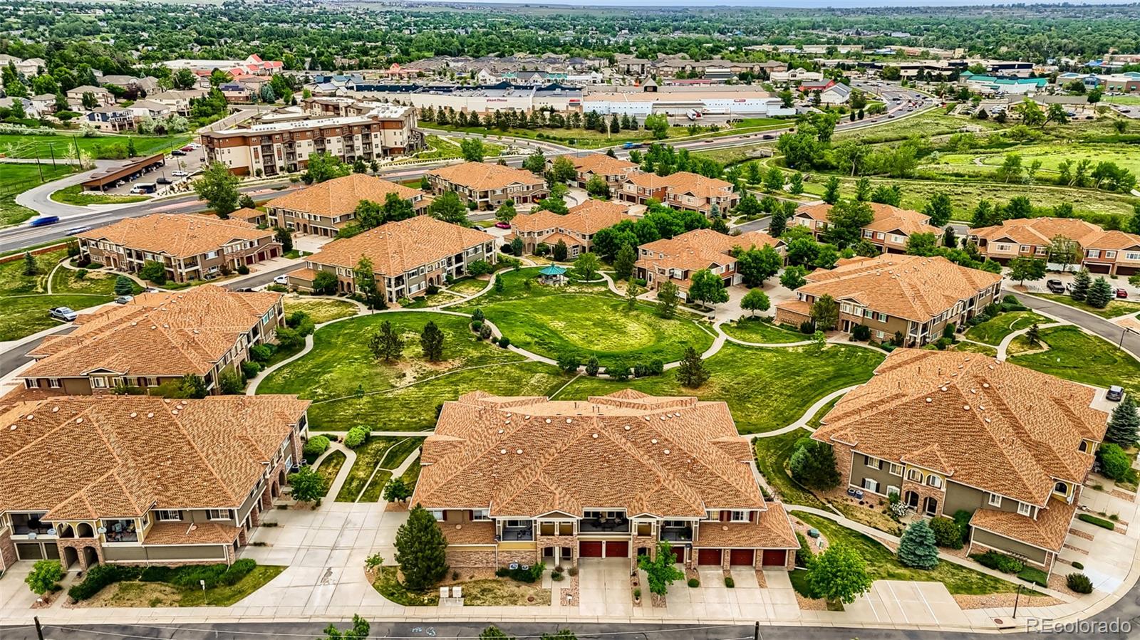 6232 Kilmer Loop, Unit 203 Golden, CO 80403 - Photo 4 of 33 an aerial view of residential houses with outdoor space and street view