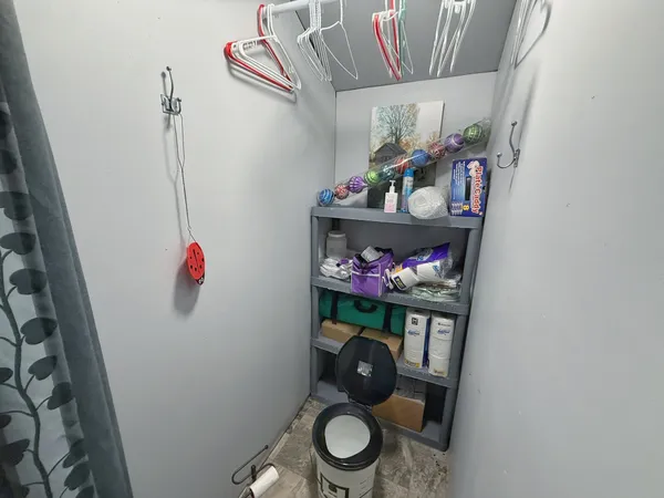 a bathroom with a sink mirror vanity and toilet