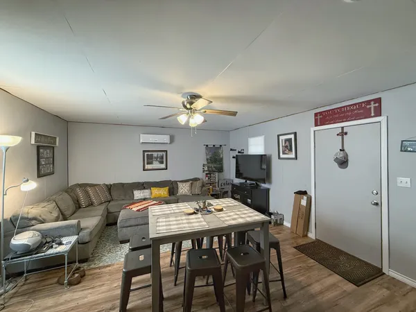 a large bedroom with a bed and a chandelier