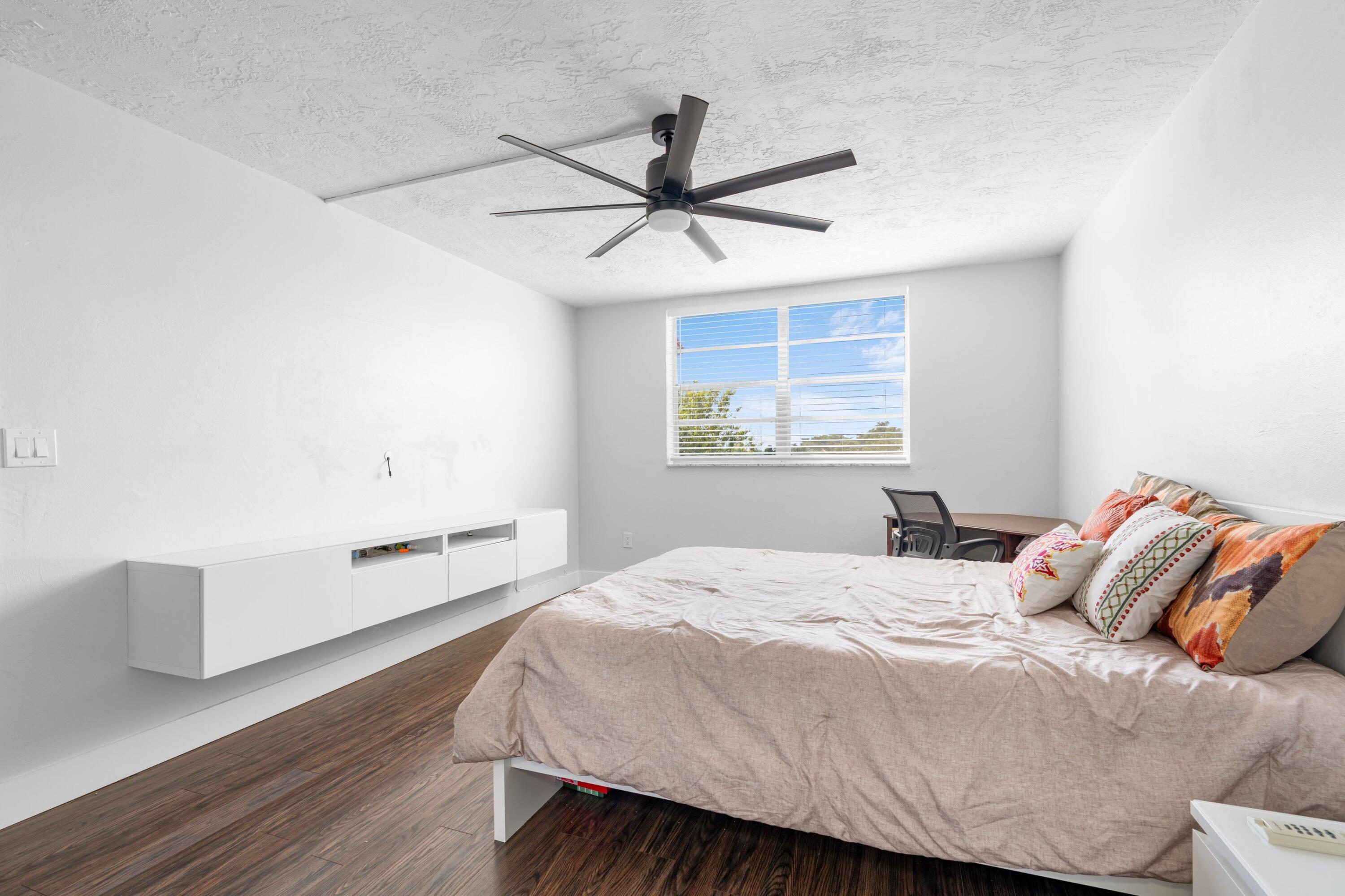 7000 Northwest 17th Street, Unit 419 Plantation, FL 33313 - Photo 12 of 23 a bedroom with a bed and a window