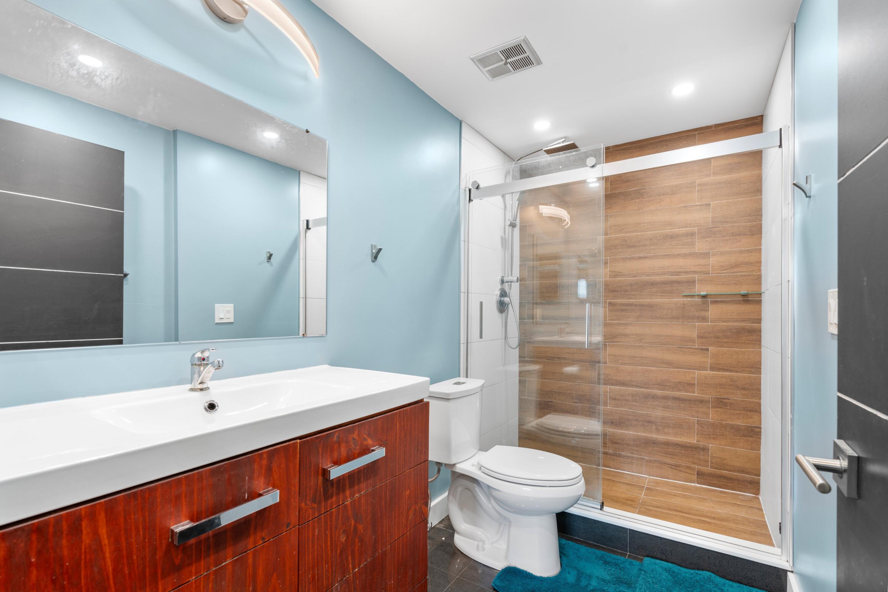 7000 Northwest 17th Street, Unit 419 Plantation, FL 33313 - Photo 14 of 23 a bathroom with a sink and a mirror