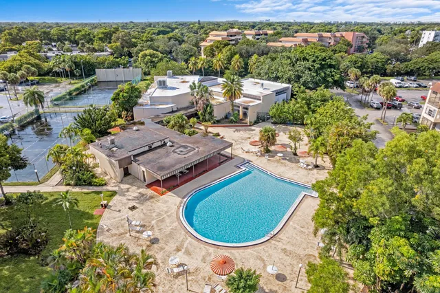 an aerial view of a house with a swimming pool