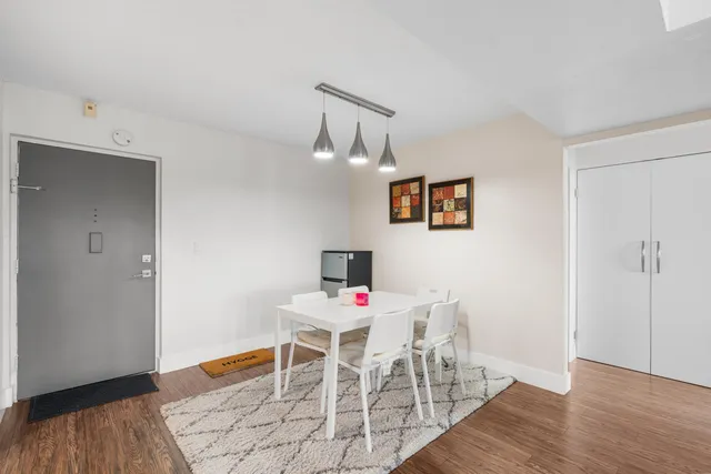 a work room with furniture and wooden floor