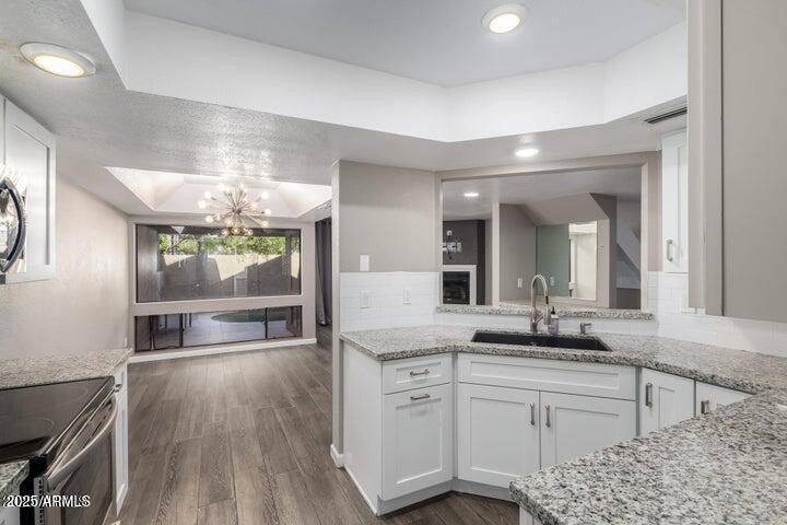 3030 North Hayden Road, Unit 16 Scottsdale, AZ 85251 - Photo 5 of 30 a bathroom with a sink a large mirror and vanity