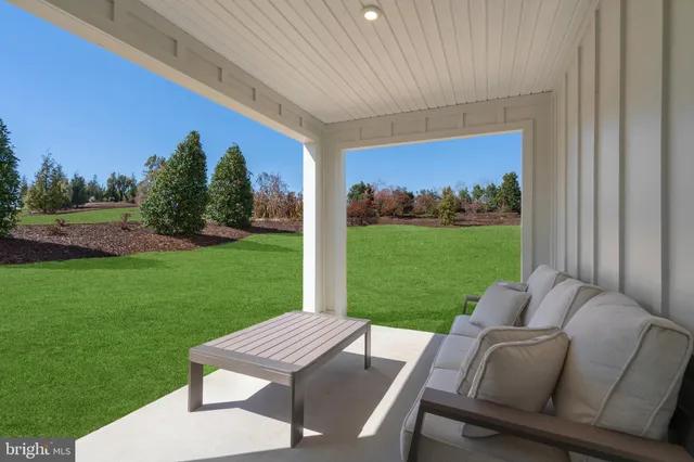 a view of a yard with furniture