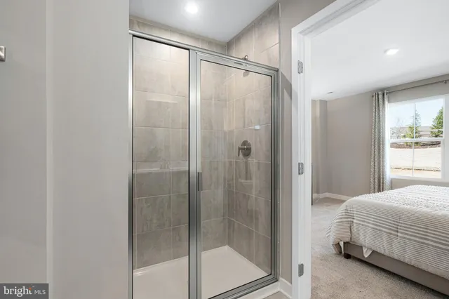 a bathroom with a glass shower door