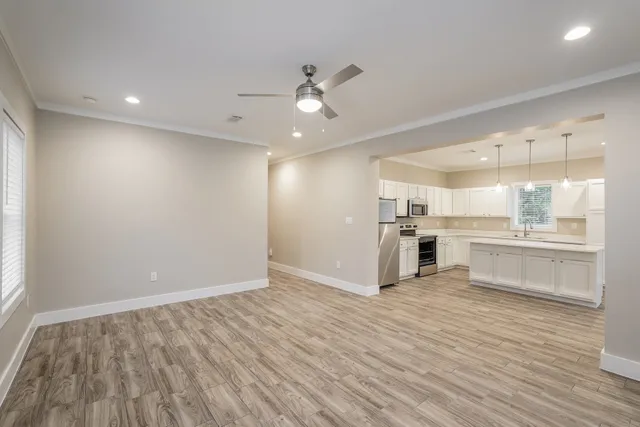 a view of kitchen with wooden floor