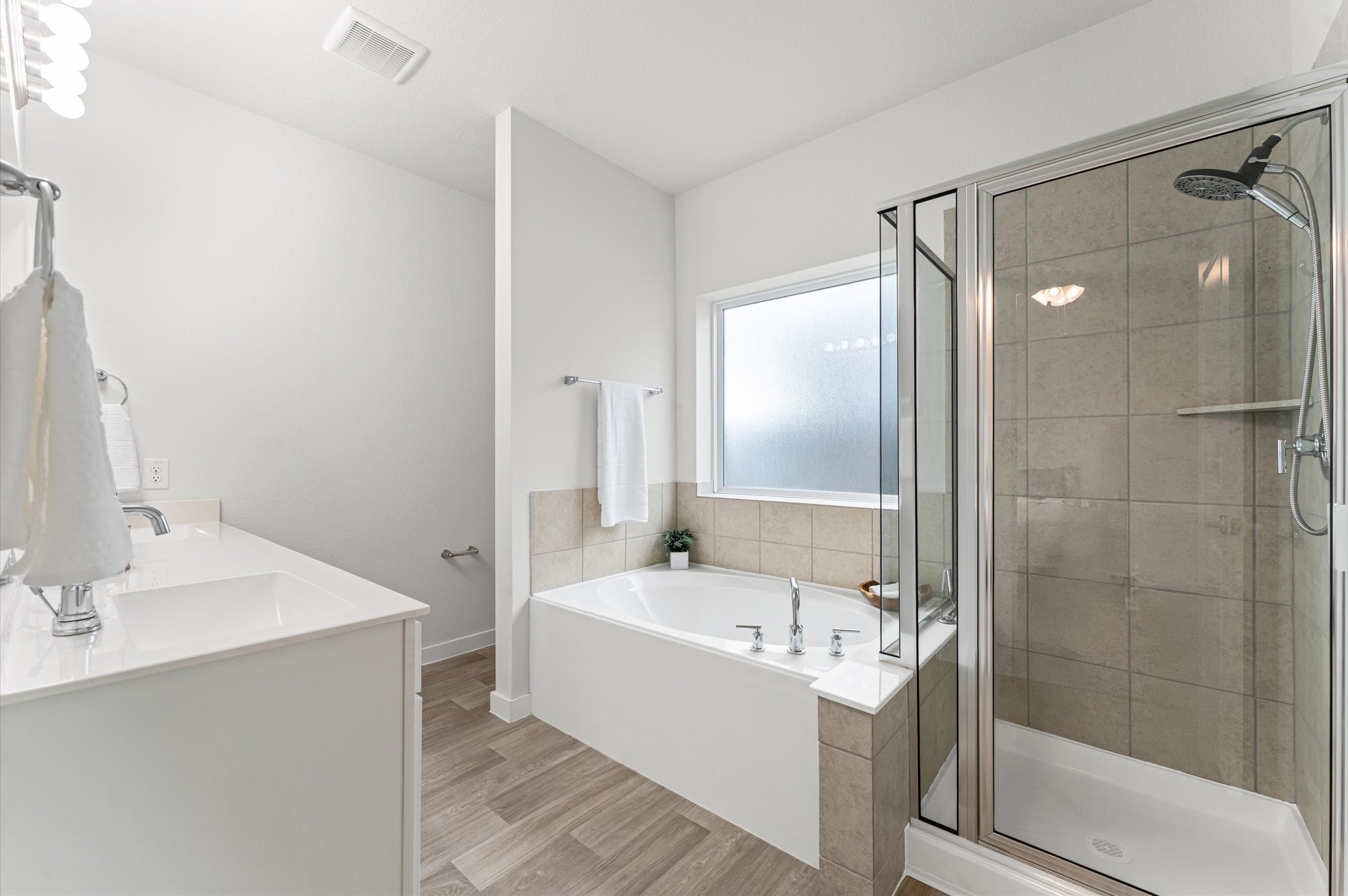 21431 Indigo Ruth Drive Spring, TX 77379 - Photo 11 of 19 a bathroom with a bathtub and a sink