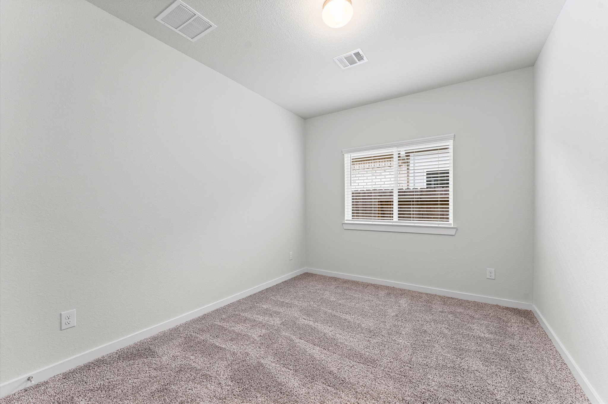 21431 Indigo Ruth Drive Spring, TX 77379 - Photo 15 of 19 an empty room with a window