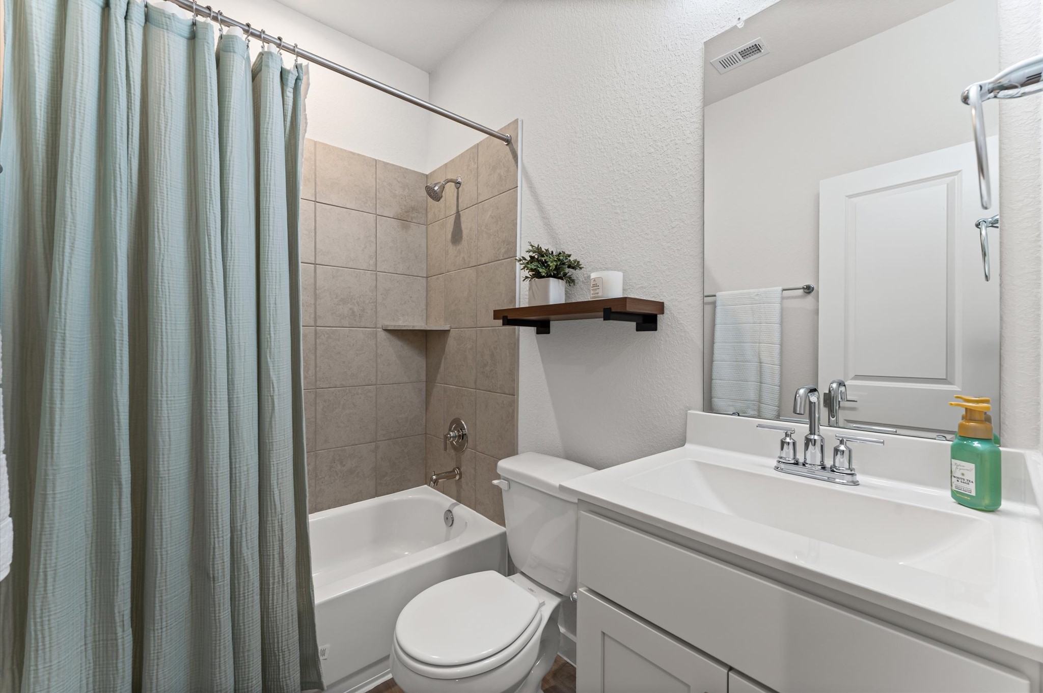 21431 Indigo Ruth Drive Spring, TX 77379 - Photo 17 of 19 a bathroom with a sink a toilet and shower