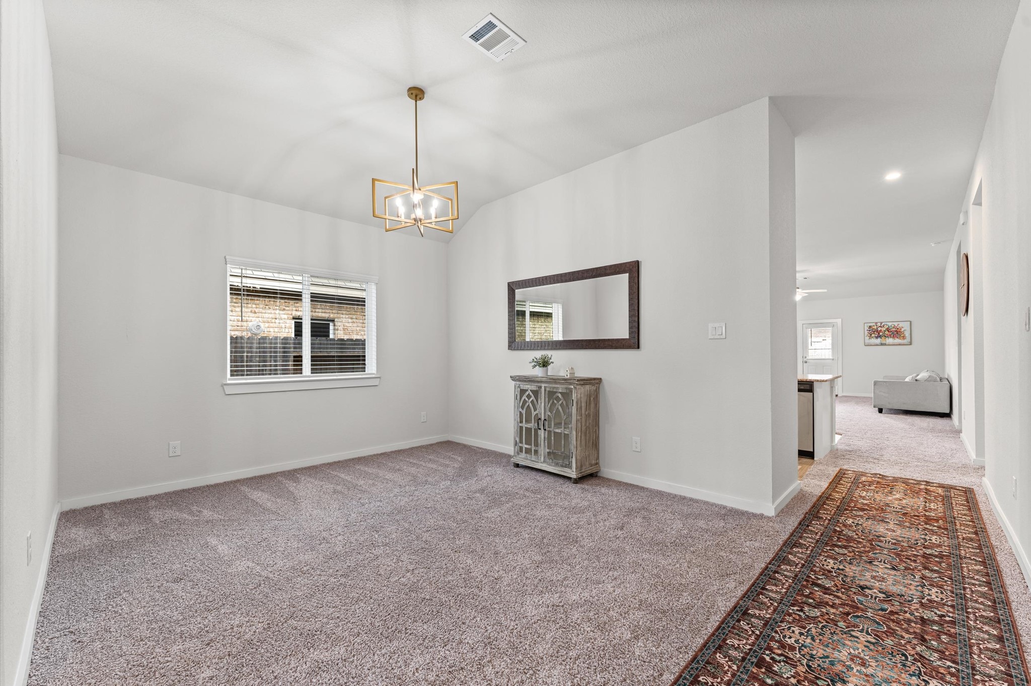 21431 Indigo Ruth Drive Spring, TX 77379 - Photo 3 of 19 a view of a room with wooden floor cabinet and a bathroom