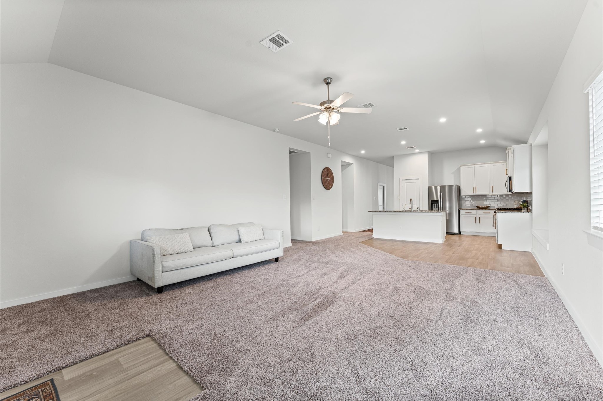 21431 Indigo Ruth Drive Spring, TX 77379 - Photo 7 of 19 a living room with furniture and kitchen view