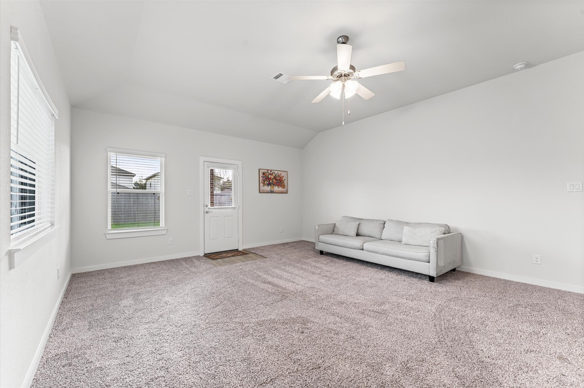 21431 Indigo Ruth Drive Spring, TX 77379 - Photo 8 of 19 an empty room with chandelier fan and windows