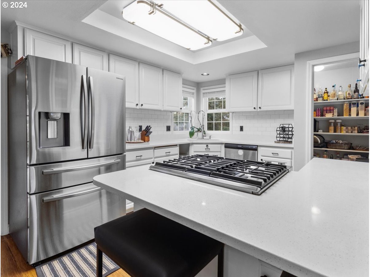 1990 Southwest Willow Parkway Gresham, OR 97080 - Photo 11 of 46 a kitchen with stainless steel appliances a refrigerator stove and sink