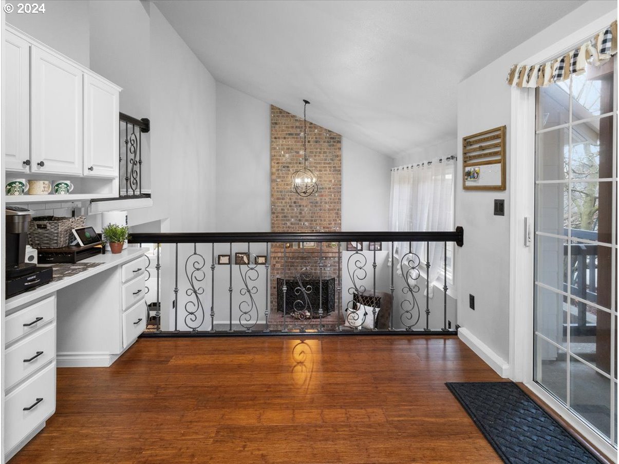 1990 Southwest Willow Parkway Gresham, OR 97080 - Photo 13 of 46 a kitchen with granite countertop a stove top oven and cabinets