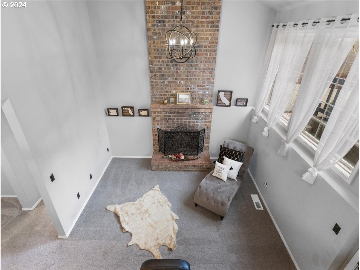 1990 Southwest Willow Parkway Gresham, OR 97080 - Photo 14 of 46 a living room with furniture and a fireplace