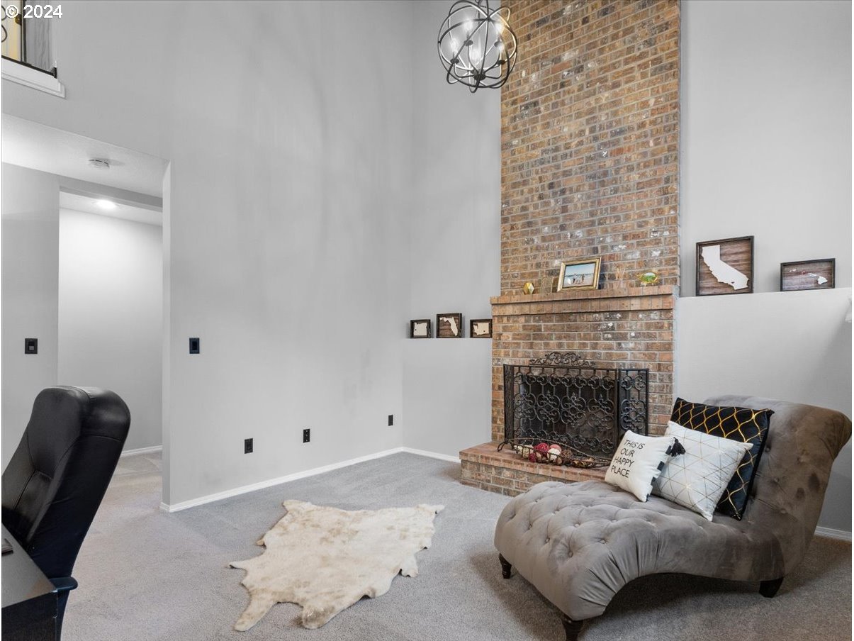 1990 Southwest Willow Parkway Gresham, OR 97080 - Photo 16 of 46 a living room with furniture and a fireplace