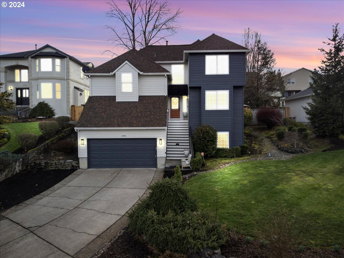 1990 Southwest Willow Parkway Gresham, OR 97080 - Photo 2 of 46 a front view of a house with yard and green space