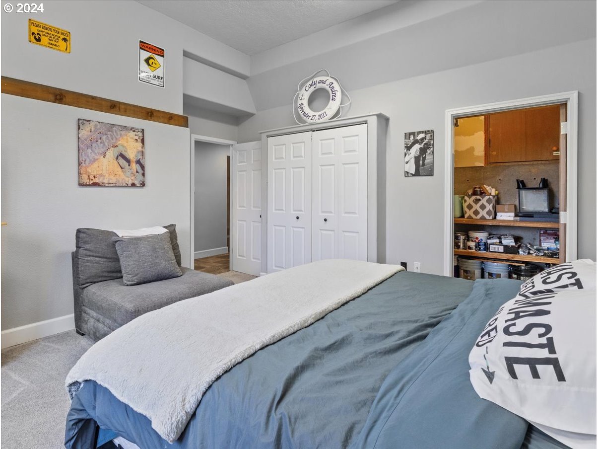 1990 Southwest Willow Parkway Gresham, OR 97080 - Photo 21 of 46 a bedroom with a bed and a dresser in it