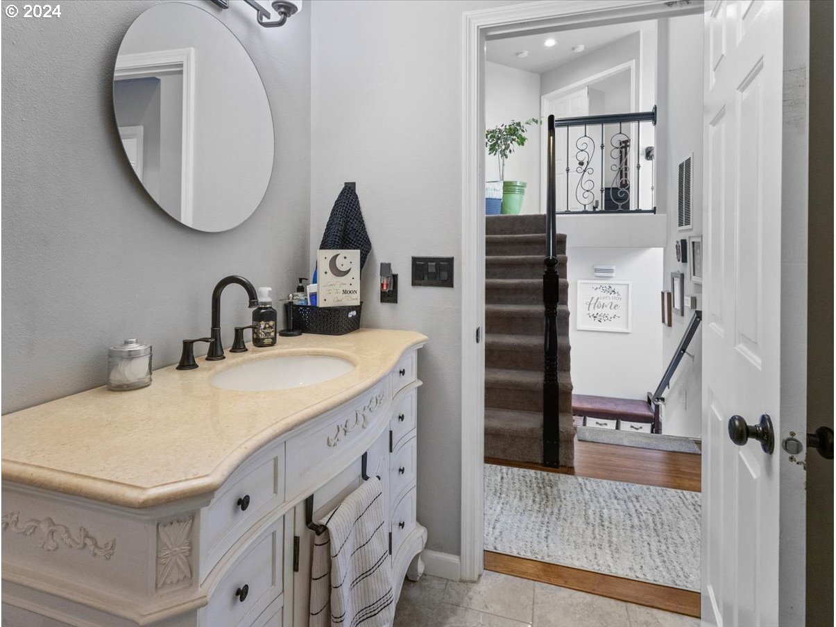 1990 Southwest Willow Parkway Gresham, OR 97080 - Photo 24 of 46 a bathroom with a sink and a mirror
