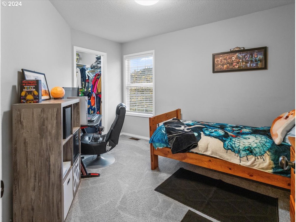 1990 Southwest Willow Parkway Gresham, OR 97080 - Photo 26 of 46 a bedroom with furniture and a window