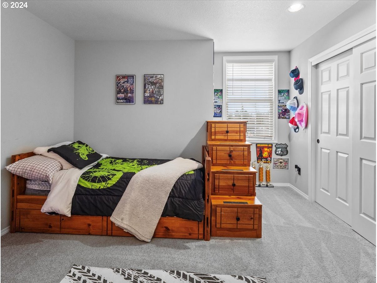 1990 Southwest Willow Parkway Gresham, OR 97080 - Photo 27 of 46 a bedroom with a bed and a window