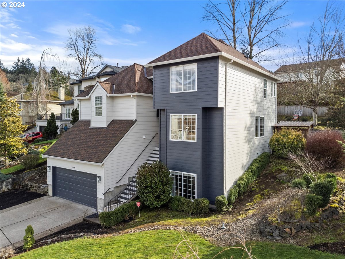 1990 Southwest Willow Parkway Gresham, OR 97080 - Photo 3 of 46 a front view of a house with garden