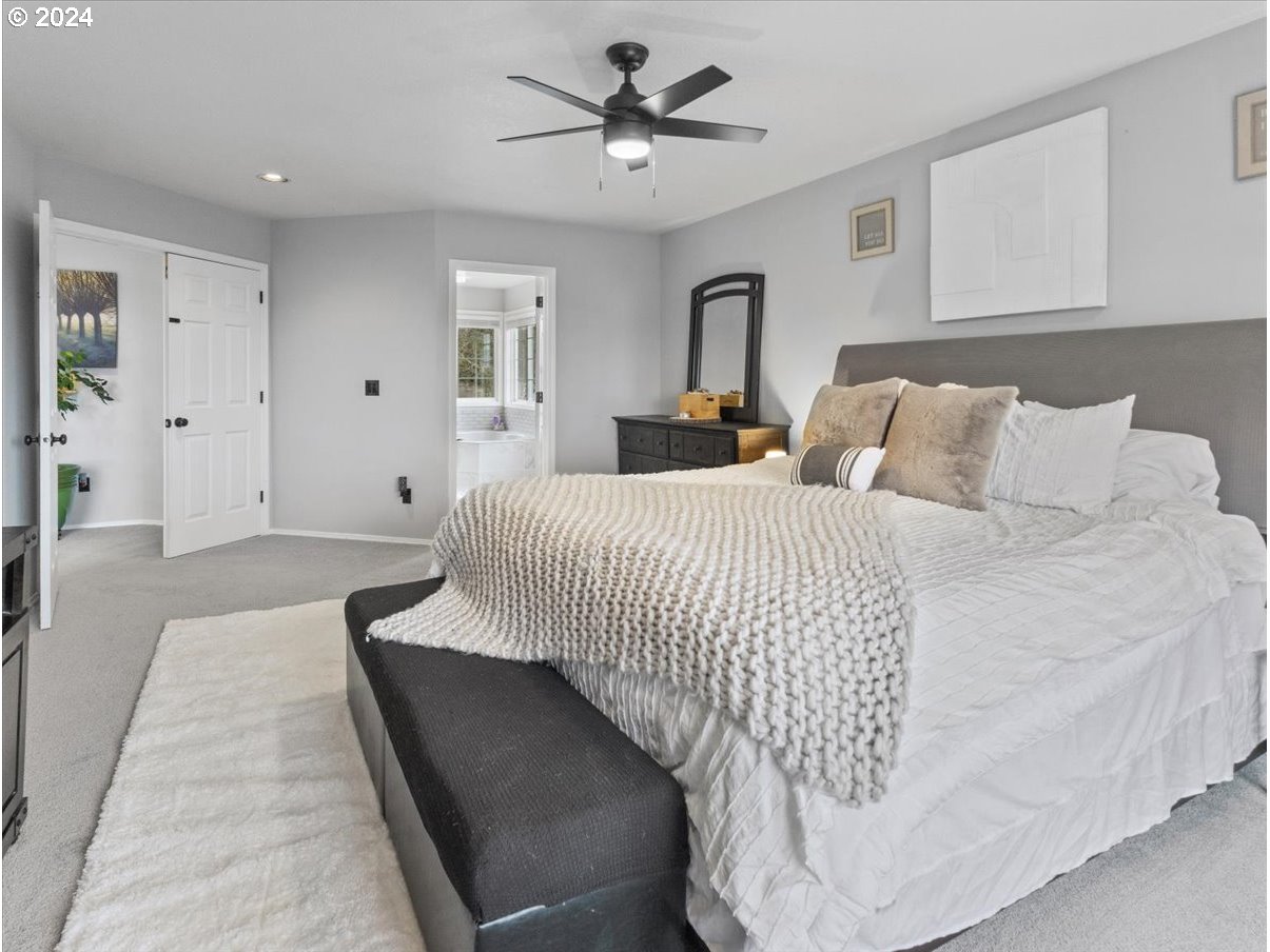 1990 Southwest Willow Parkway Gresham, OR 97080 - Photo 32 of 46 a bedroom with bed and a chandelier