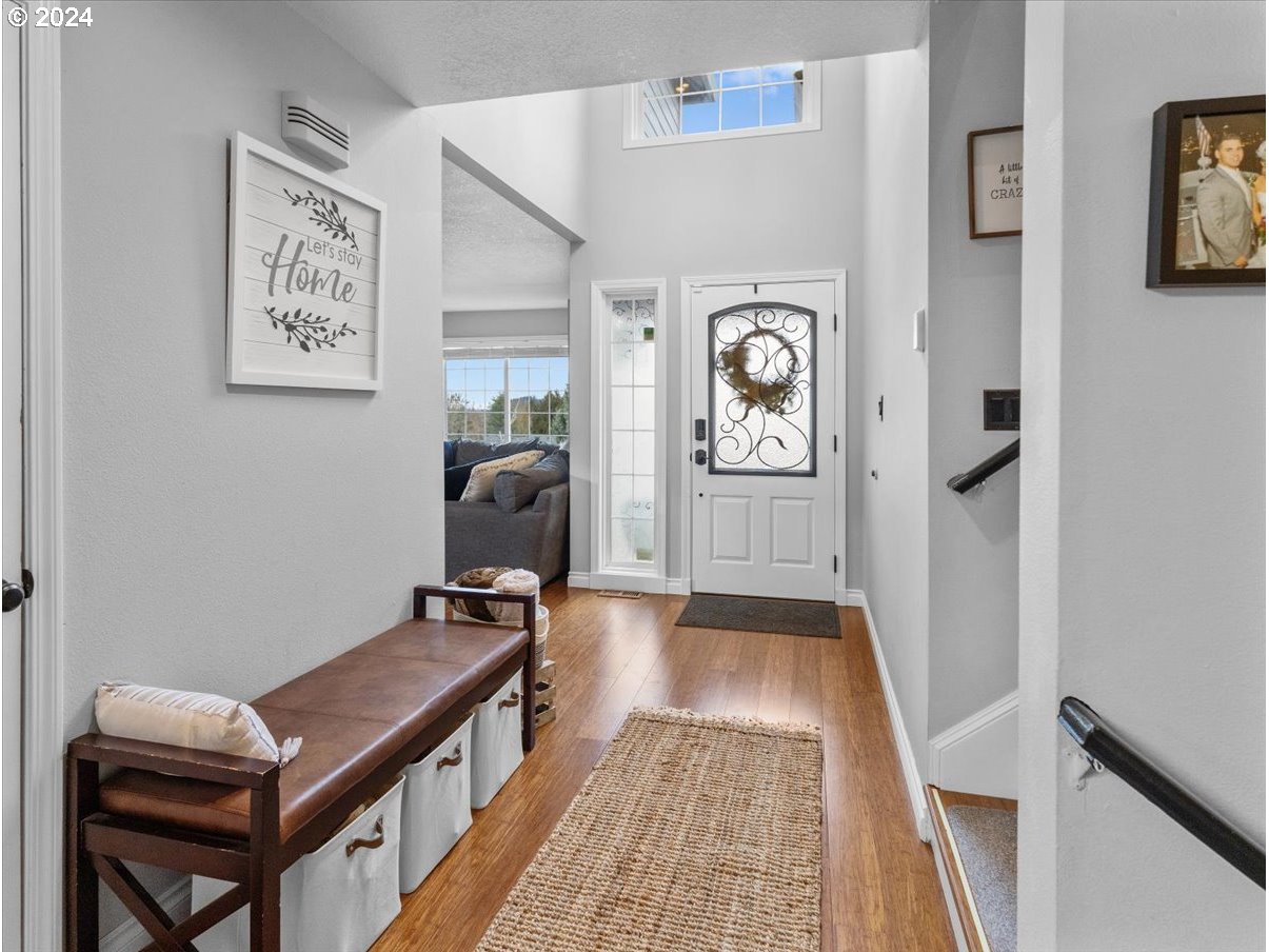 1990 Southwest Willow Parkway Gresham, OR 97080 - Photo 5 of 46 a hallway with furniture and wooden floor