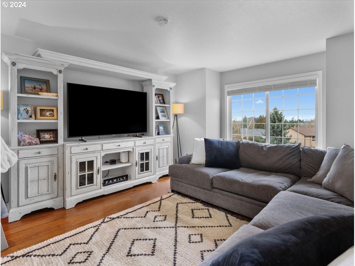 1990 Southwest Willow Parkway Gresham, OR 97080 - Photo 6 of 46 a living room with furniture and a flat screen tv
