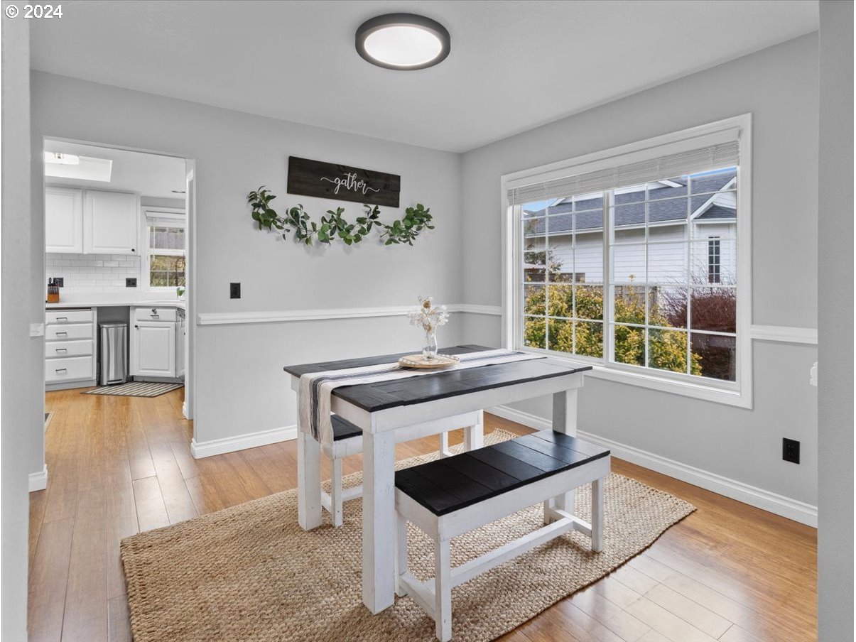 1990 Southwest Willow Parkway Gresham, OR 97080 - Photo 9 of 46 a kitchen with stainless steel appliances granite countertop a stove and a sink