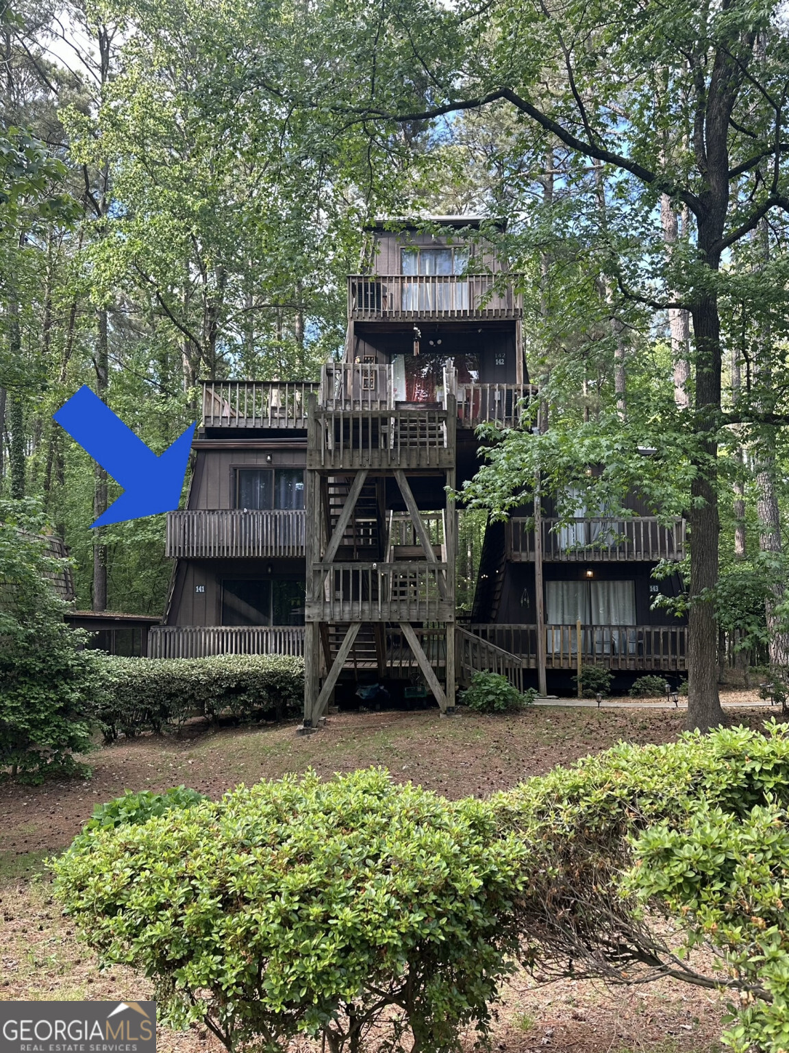 3200 Rim Cove Drive, Unit 141 Cumming, GA 30041 - Photo 1 of 1 a view of a house with a yard and furniture