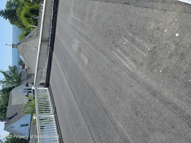 a view of balcony with wooden floor